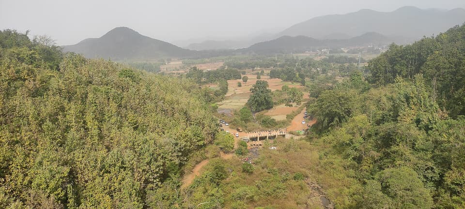 View over a green valley from the Kirandul railway line